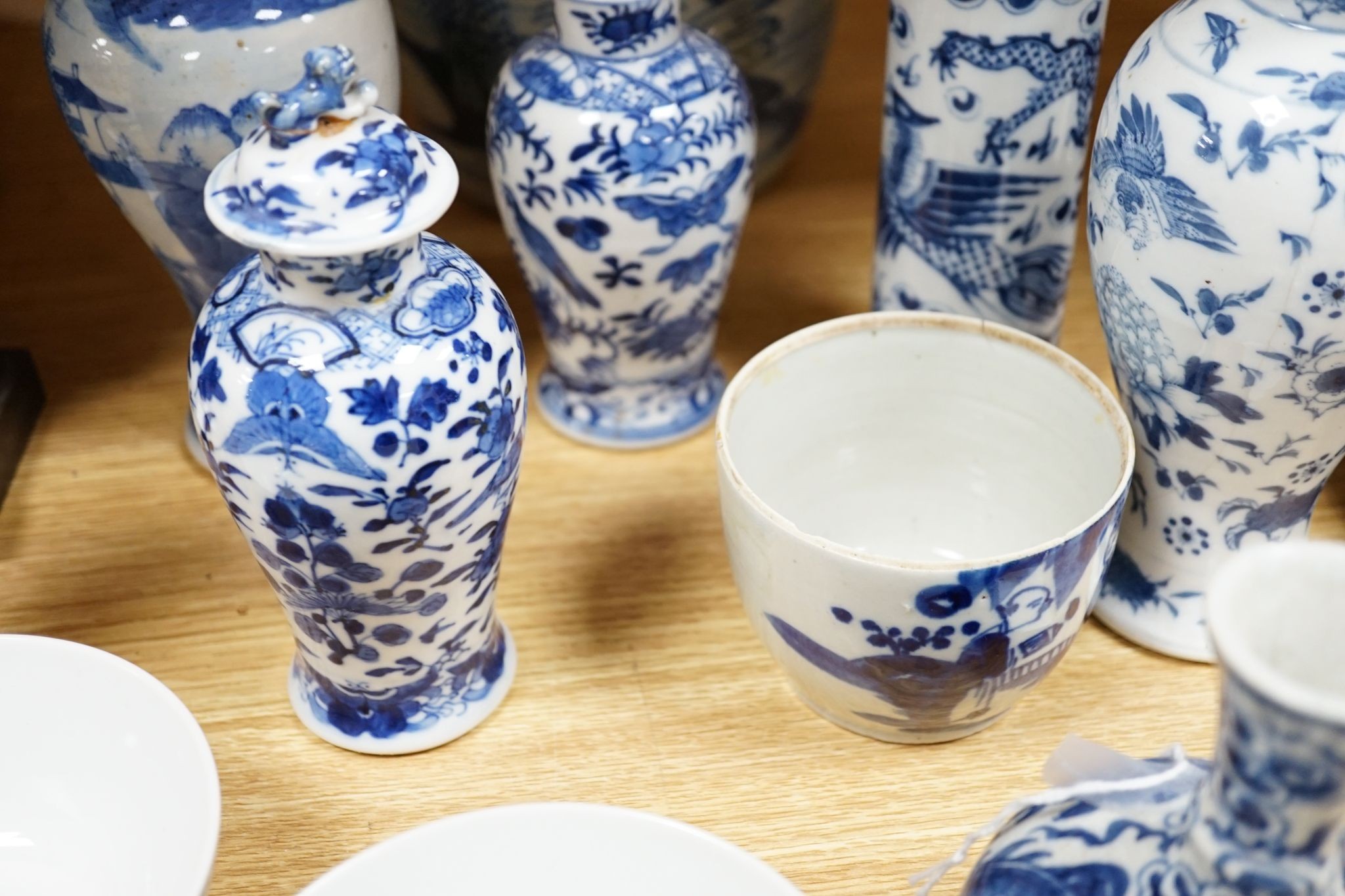 Twelve pieces of 19th century Chinese blue and white tableware and a small famille rose bowl, largest 20cm